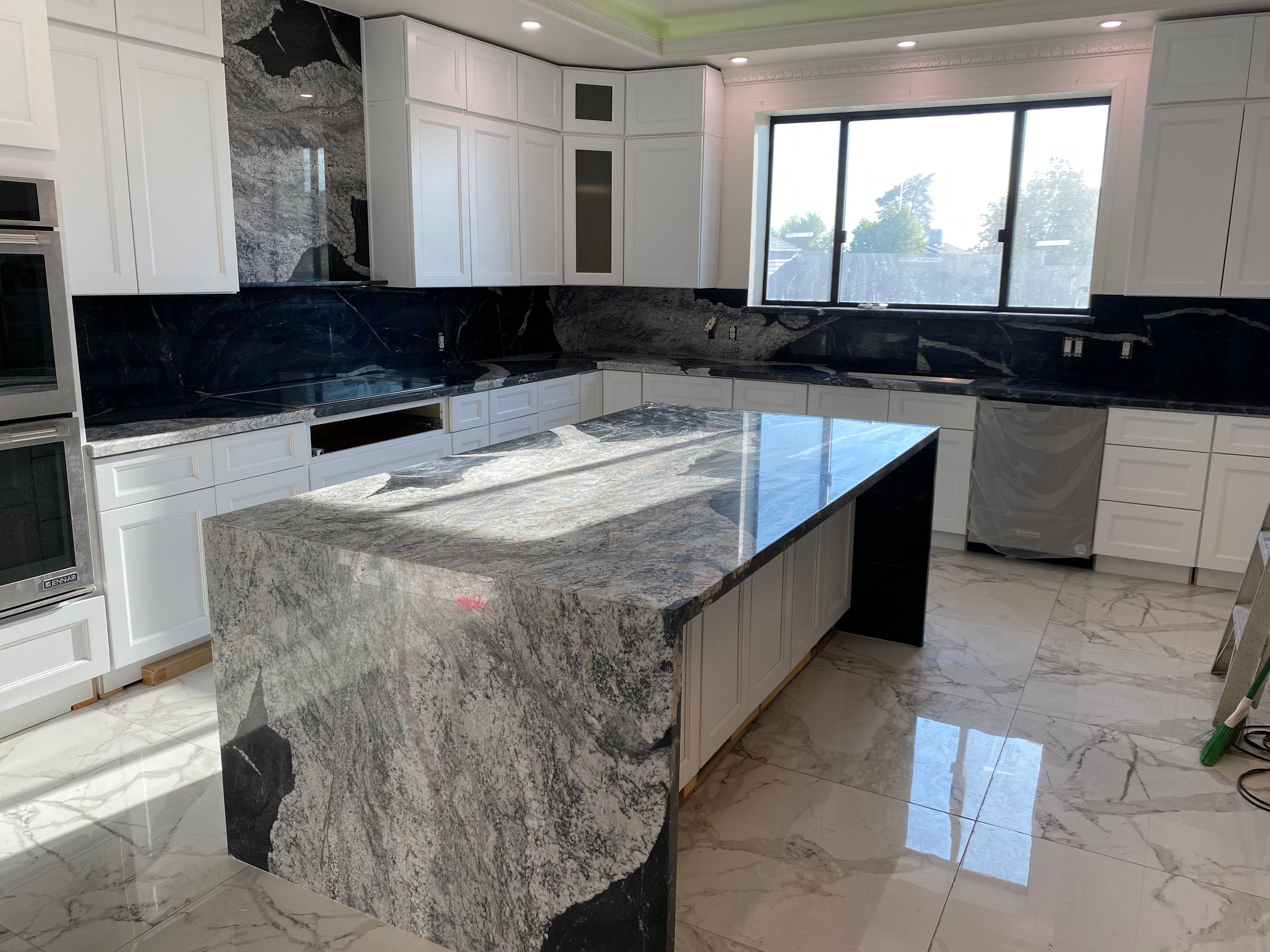 Granite Kitchen with Waterfall Edge and Full Backplash
